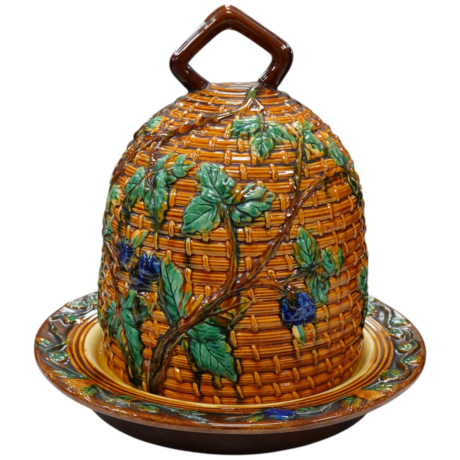 A Minton style majolica cheese dome and stand, 32cm. Condition - fair to good, some crazing